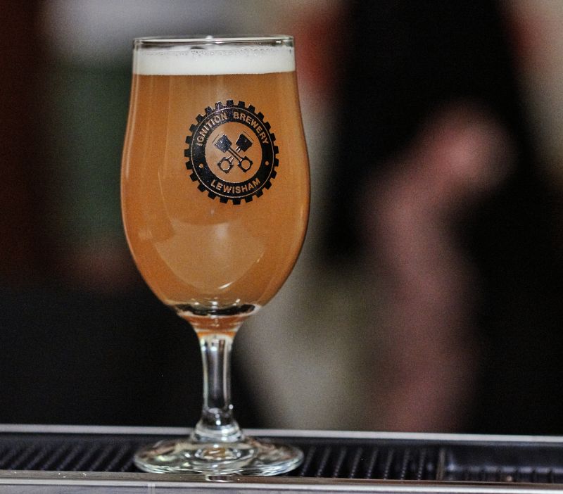 a ignition brewery beer with their logo on the glass